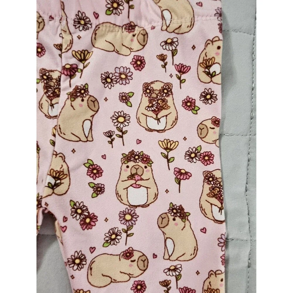 Penelope Mack,  pink capybaras and floral Pjs